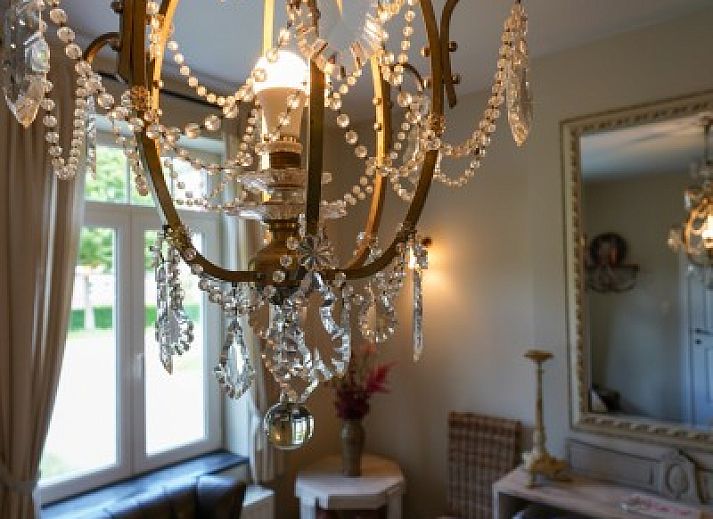 Cozy bedroom in vacation home Tivoli, Dilsen-Stokkem, Limburg, Belgium with classic interior and wooden floor.