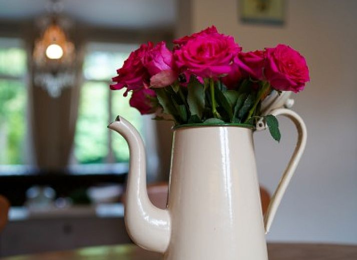 Cozy bedroom in vacation home Tivoli, Dilsen-Stokkem, Limburg, Belgium with classic interior and wooden floor.