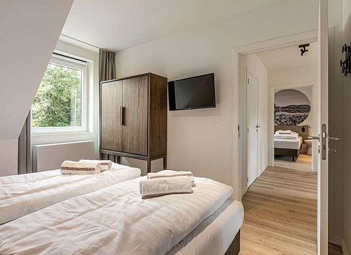Plattegrond van Mooi Zutendaal 6-persoons villa in Limburg, Belgie, met ruime slaapkamers en moderne badkamers voor een comfortabel verblijf.