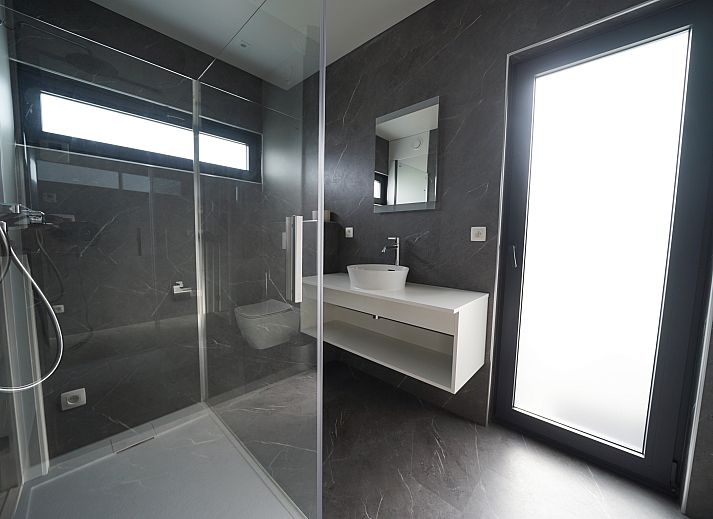 Chalet in Zutendaal overlooking water and green surroundings in Limburg, Belgium. Enjoy the serene nature from this modern vacation accommodation.