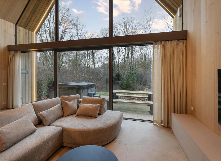 Lodge with Jacuzzi in Heusden-Zolder, Limburg, Belgium, surrounded by nature with modern wooden design and spacious garden.