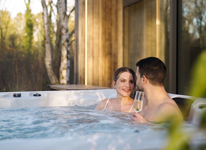 Lodge with Jacuzzi in Heusden-Zolder, Limburg, Belgium, surrounded by nature with modern wooden design and spacious garden.