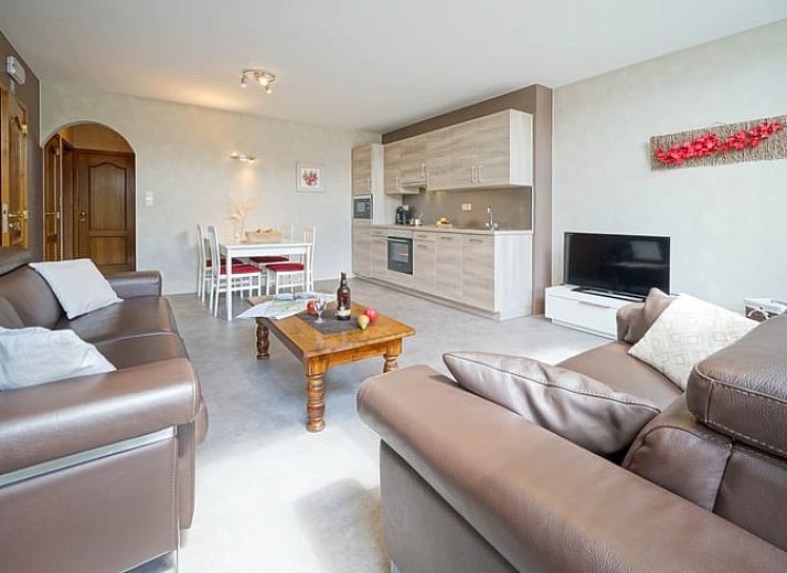Modern kitchen in Holiday home in Hombourg, Ardennes, with wooden cabinets and dining area, ideal for a comfortable stay in Belgium.