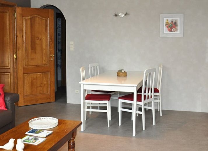 Modern kitchen in Holiday home in Hombourg, Ardennes, with wooden cabinets and dining area, ideal for a comfortable stay in Belgium.