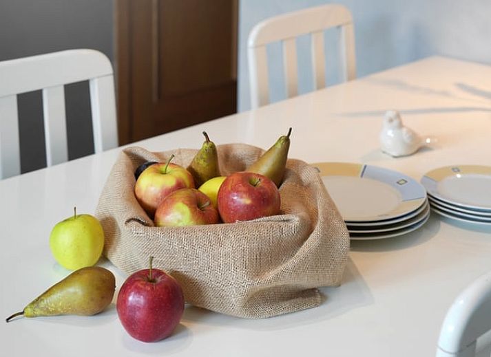 Cozy living room in Holiday Home in Hombourg, Ardennes, with comfortable sitting area and open kitchen, perfect for relaxation in Belgium.