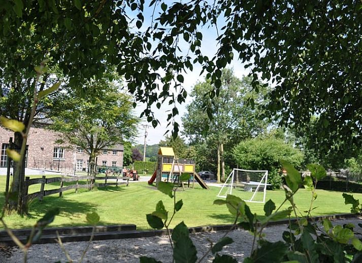 Exterior of Holiday home in Hombourg, Ardennes, with rainbow and green surroundings, idyllic location for a vacation in Belgium.