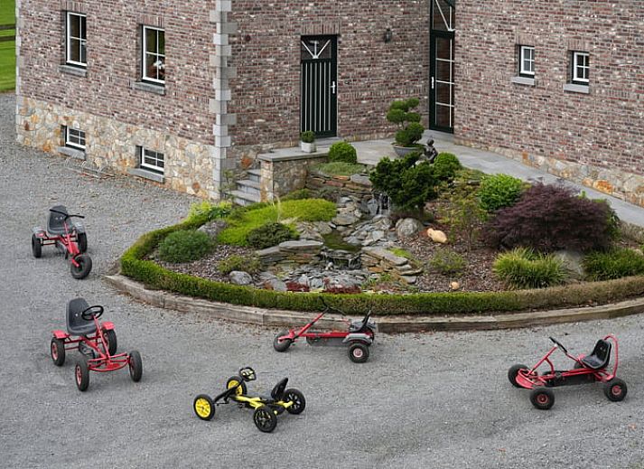 Dining area in Holiday Home in Hombourg, Ardennes, with wooden door and bright decor, ideal for meals during your stay in Belgium.