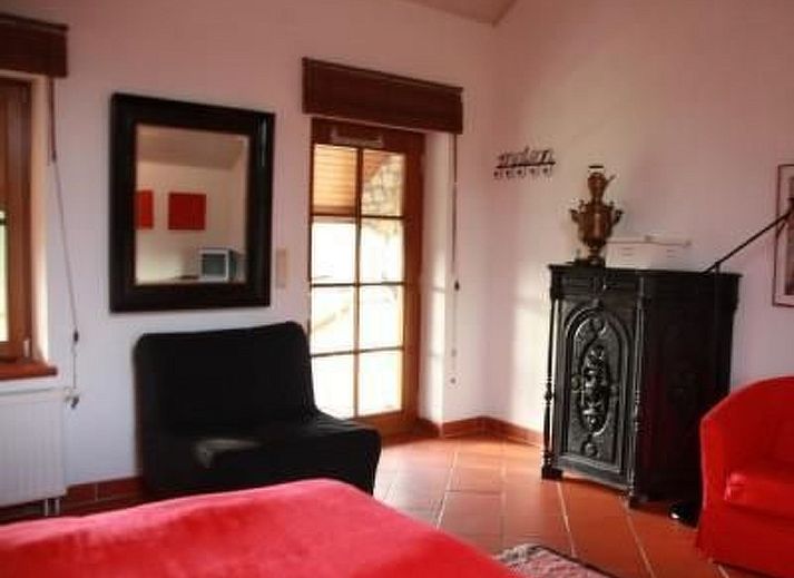 Charming Apartment Vue au Jardin with stone facade and terrace in Hombourg, Ardennes, Belgium, ideal for nature lovers.