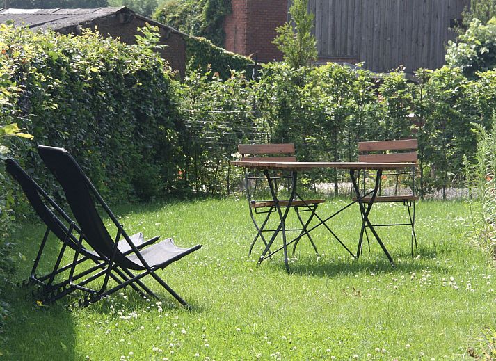 Cozy bedroom of Apartment Vue au Jardin in Hombourg, Ardennes, with a comfortable bed and views of the green surroundings.