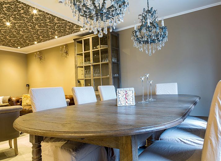 Cozy bedroom in Holiday Home Villa 'Marie France' Wellness, Stavelot, Ardennes, with authentic wooden interior and rustic ceiling.