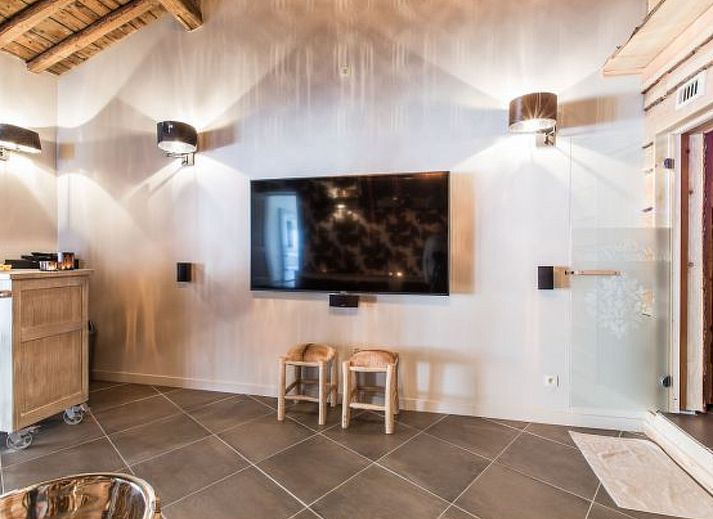 Cozy bedroom in Holiday Home Villa 'Marie France' Wellness, Stavelot, Ardennes, Belgium, with rustic interior and warm lighting.