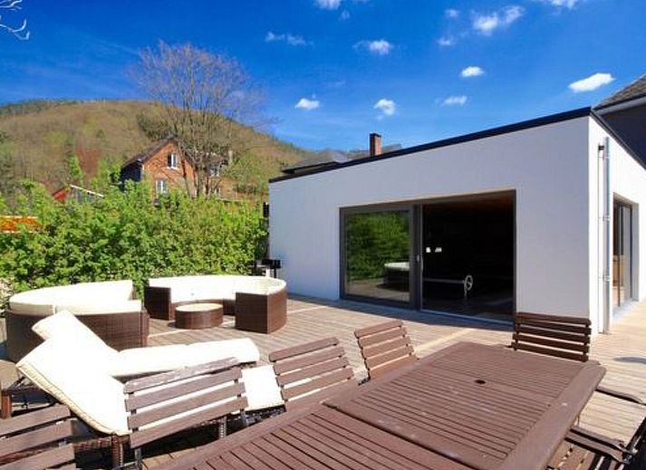 Cozy bedroom in Holiday Home Villa 'Marie France' Wellness, Stavelot, Ardennes, Belgium, with rustic interior and warm lighting.