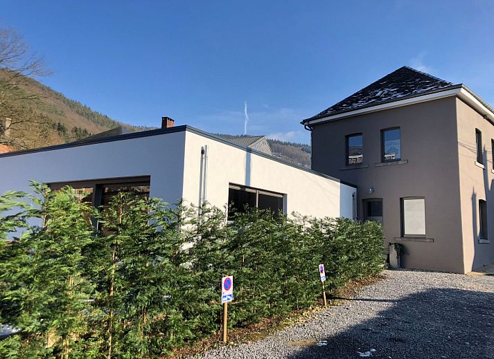 Cozy bedroom in Holiday Home Villa 'Marie France' Wellness, Stavelot, Ardennes, Belgium, with rustic interior and warm lighting.
