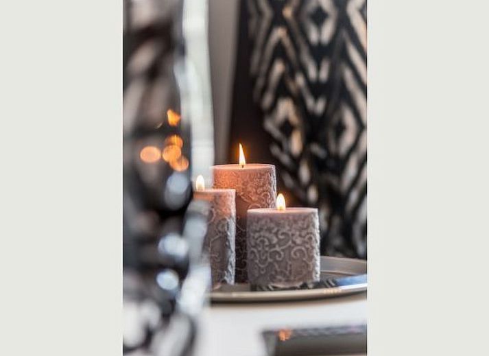 Cozy bedroom in Holiday Home Villa 'Marie France' Wellness, Stavelot, Ardennes, with authentic wooden bed and elegant chairs.