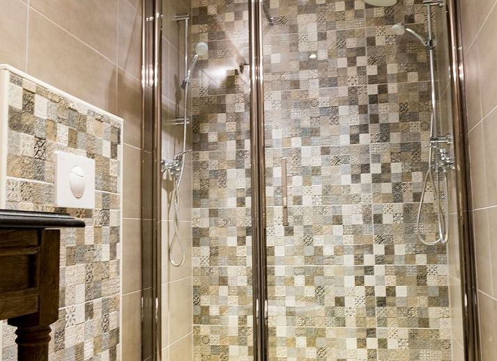 Charming interior of Holiday Home Villa 'Marie France' Wellness in Stavelot, Ardennes, with rustic wooden chest of drawers and decorations.
