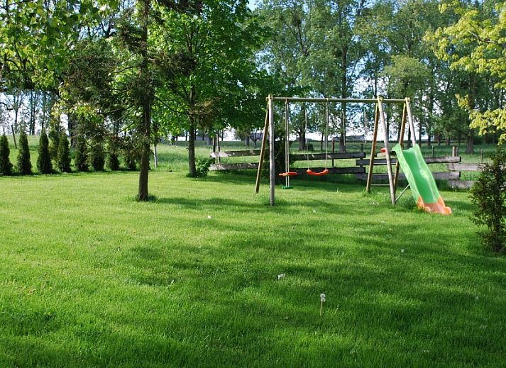 Gites d'Ogne vakantiehuis in Sprimont-Ogne, Ardennen, Belgie met prachtige stenen gevel en weelderige groene omgeving.