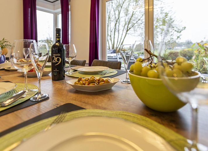 Gezellige woonkamer van Residence Supreme vakantiehuis in Marchin, Ardennen, met comfortabele zithoek.