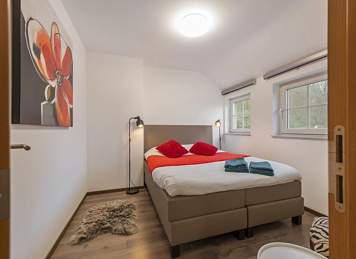Gezellige woonkamer van Residence Supreme vakantiehuis in Marchin, Ardennen, met comfortabele zithoek.