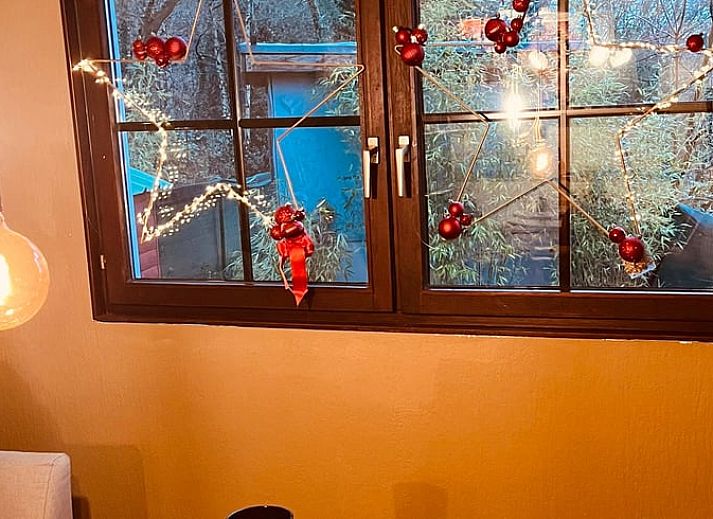 Atmospheric Christmas decorations in the living room of Cottage in Kelmis, vacation home in the Ardennes, Belgium.