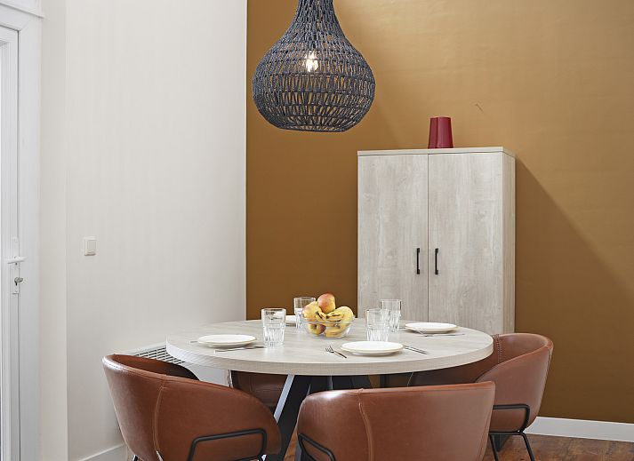 Stylish living room in Village l'Eau d'Heure 4-person dog bungalow, Froidchapelle, Hainaut, Belgium with modern furniture and open kitchen.