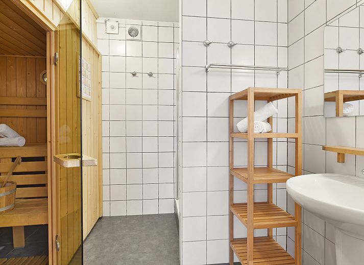 Stylish living room in Village l'Eau d'Heure 6-bed bungalow, Froidchapelle, Hainaut, Belgium with modern decor and cozy sitting area.