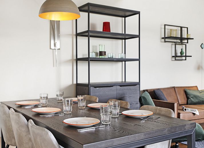 Cozy interior of Village l'Eau d'Heure 6-bed bungalow in Froidchapelle, Hainaut, Belgium, with modern kitchen and sitting area.