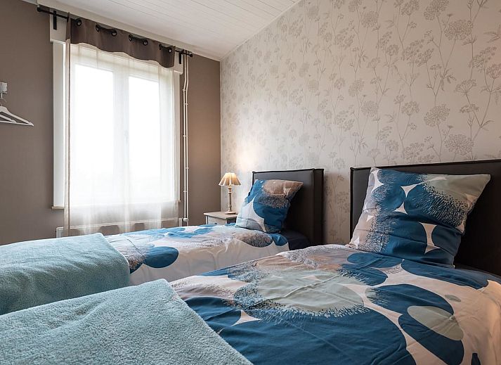 Vakantiehuis Memories in Le Bizet, Henegouwen, Belgie, met charmante bakstenen gevel en uitnodigend terras voor een ontspannen verblijf.