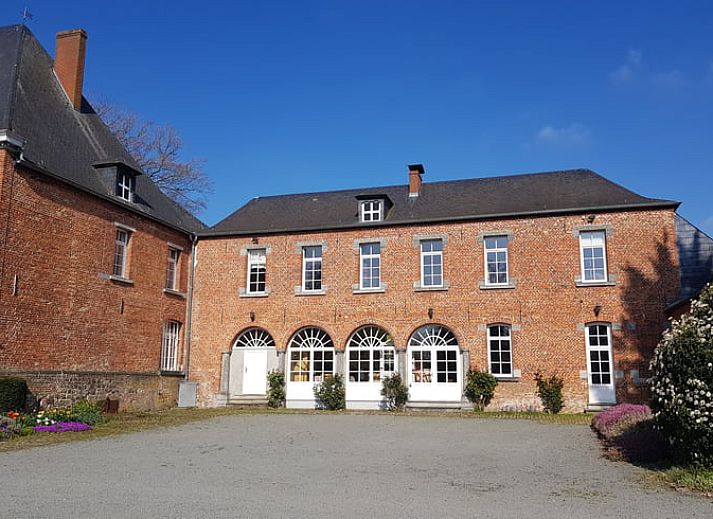 Cozy living room with fireplace in Holiday home in Sars-la-Bruyere, Hainaut, Belgium.
