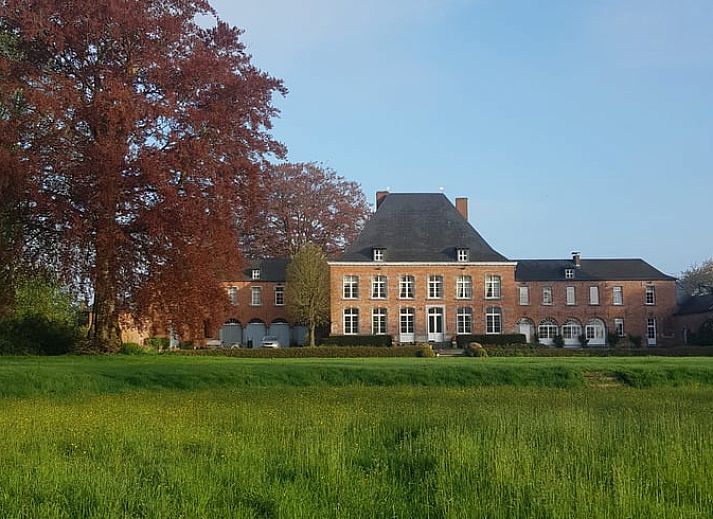 Cozy living room with fireplace in Holiday home in Sars-la-Bruyere, Hainaut, Belgium.