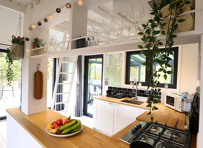 Enjoy relaxation at chalet Agathe in Laforet, Ardennes, with a pool table in the bright indoor space surrounded by nature.