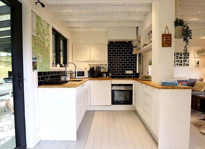 Enjoy relaxation at chalet Agathe in Laforet, Ardennes, with a pool table in the bright indoor space surrounded by nature.