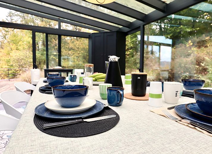 Enjoy relaxation and games at Chalet Agathe, Laforet, Ardennes. Bright indoor space with ping pong table and views of nature.