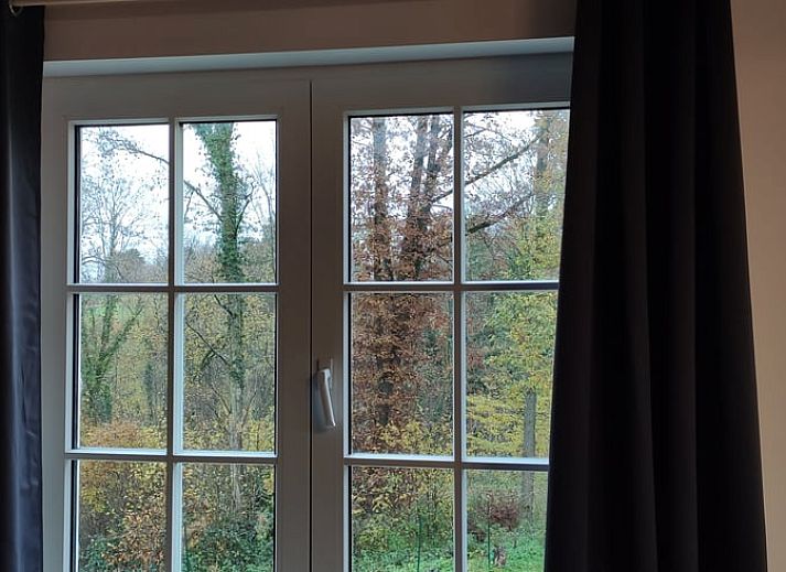 Vacation home in Fosses-la-Ville with green garden and sitting area, perfect for relaxation in the Ardennes, Belgium.