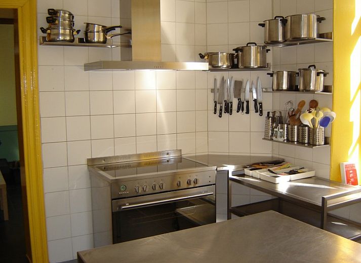 Knusse zithoek met open haard in Maison Del Campo, vakantiehuis in de Ardennen.