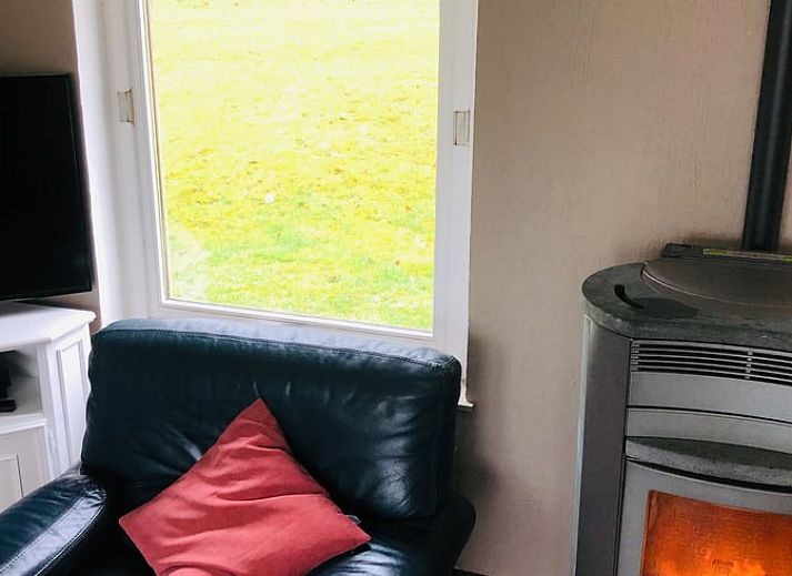 Knusse open haard in Vakantiehuisje in Gros Fays, een warme retraite in de Ardennen, Namen, Belgie.