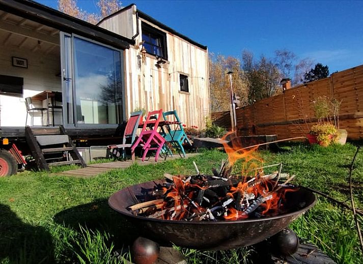 Snowy landscape around Cottage in Gesves, a cottage in the Ardennes, with a charming wooden veranda.