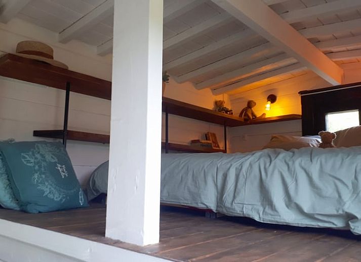 Snowy landscape around Cottage in Gesves, a cottage in the Ardennes, with a charming wooden veranda.