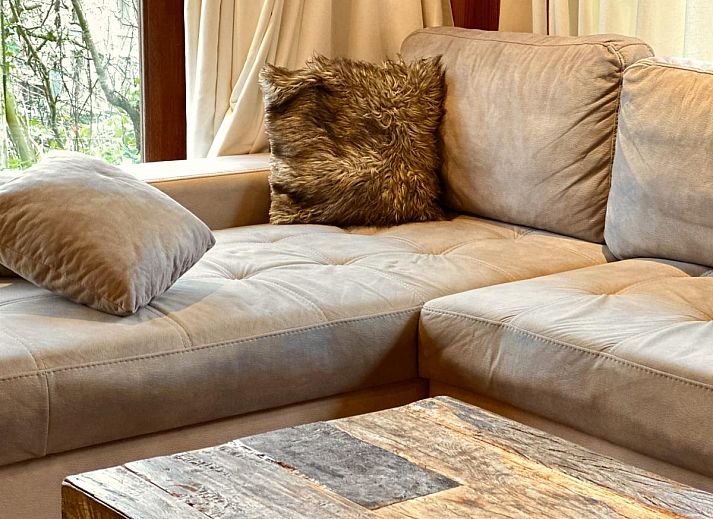 Enjoy the terrace of Leora Cosy vacation home in Membre, Ardennes, overlooking the green hills and an inviting garden.