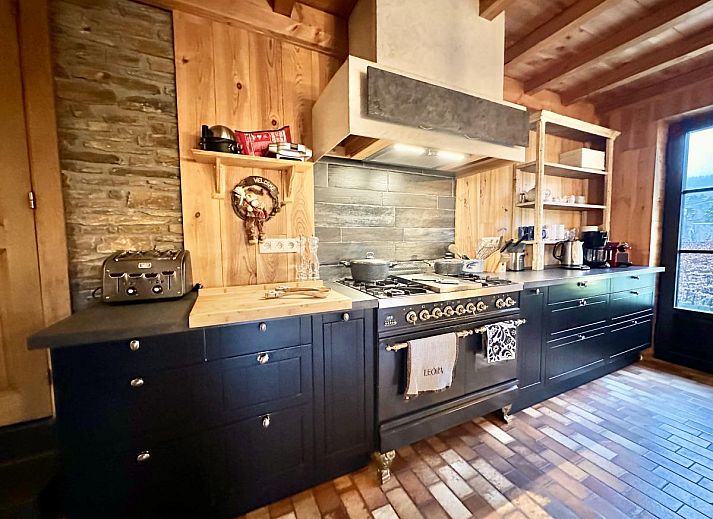 Leora Cosy vacation home in Membre, Ardennes, Belgium with sunny terrace and green surroundings for a relaxing stay.