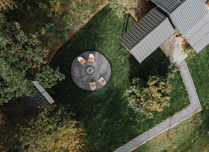 Relax by the fire pit of Cottage in Dion, cottage in the Ardennes, Belgium, surrounded by lush nature.