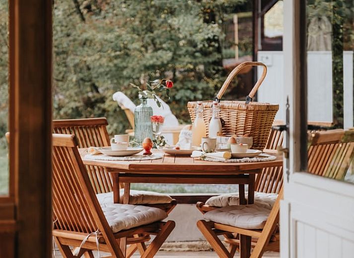 Private Jacuzzi in Cottage in Dion, cottage in Ardennes, Belgium, offers peace and relaxation in a wooded setting.