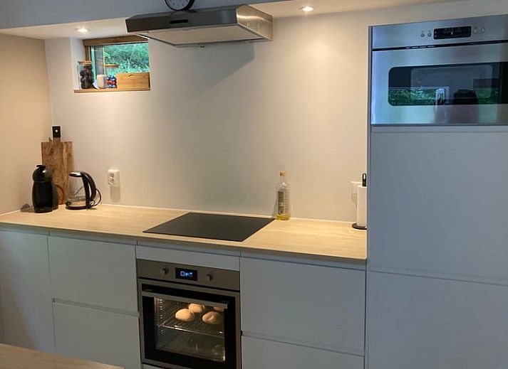 Cozy dining room of Cottage in Oignies en Thierache, cottage in the Ardennes, with modern decor in Oignies-en-Thierache.