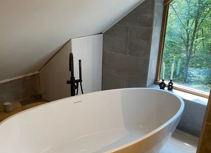 Stylish living room of Cottage in Oignies en Thierache, vacation accommodation in the Ardennes, overlooking nature in Oignies-en-Thierache.