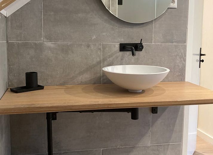 Stylish living room of Cottage in Oignies en Thierache, vacation accommodation in the Ardennes, overlooking nature in Oignies-en-Thierache.