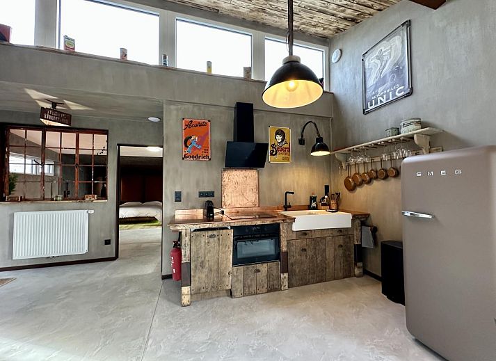 Luxury bathroom in Chez Brigitte vacation home, Durbuy, Ardennes, with modern bathtub and rustic sink for ultimate relaxation.