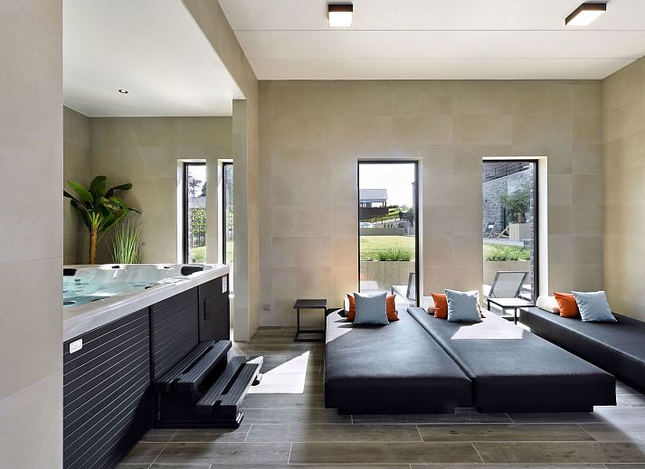 Luxurioeses Schlafzimmer im Ferienhaus Durbuy Suites, in den Ardennen, Belgien. Geniessen Sie Komfort und Stil in diesem eleganten Ferienhaus.