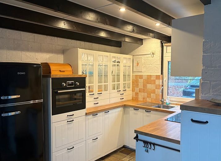 Cottage in Izier, a charming vacation home in the Ardennes, Luxembourg, Belgium, surrounded by green nature and peaceful surroundings.