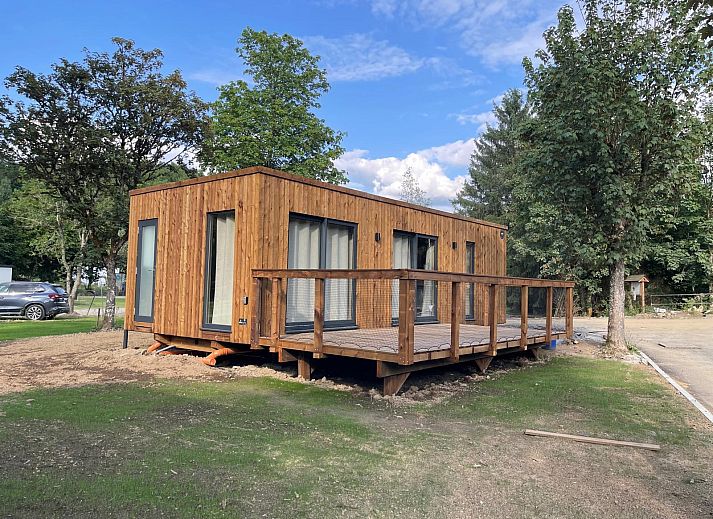 Ecolodge cottage with wooden terrace in the nature of Houffalize, Ardennes, Belgium.
