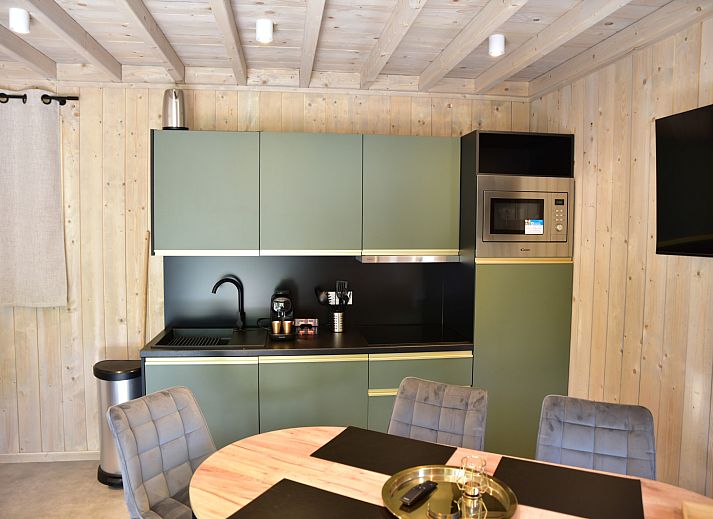 Ecolodge cottage with wooden terrace in the nature of Houffalize, Ardennes, Belgium.