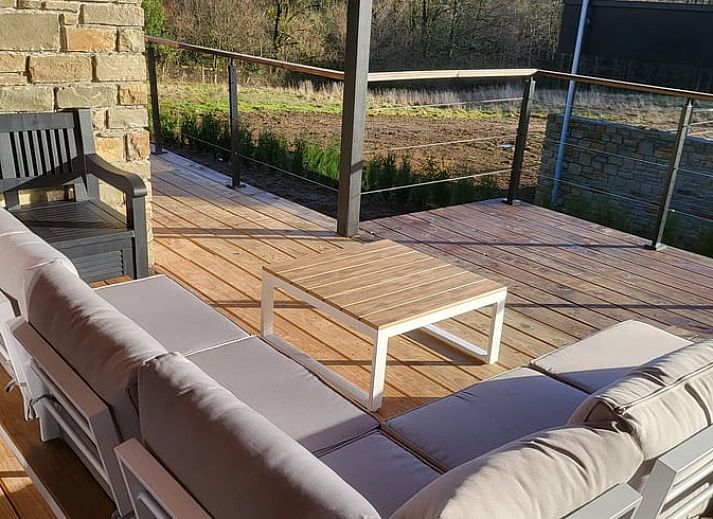 Cozy interior of Cottage in Grandmenil, vacation home in Ardennes, Belgium with modern kitchen and comfortable seating area.